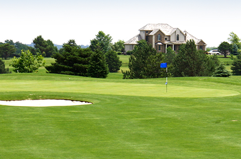 view of clubhouse and golf green